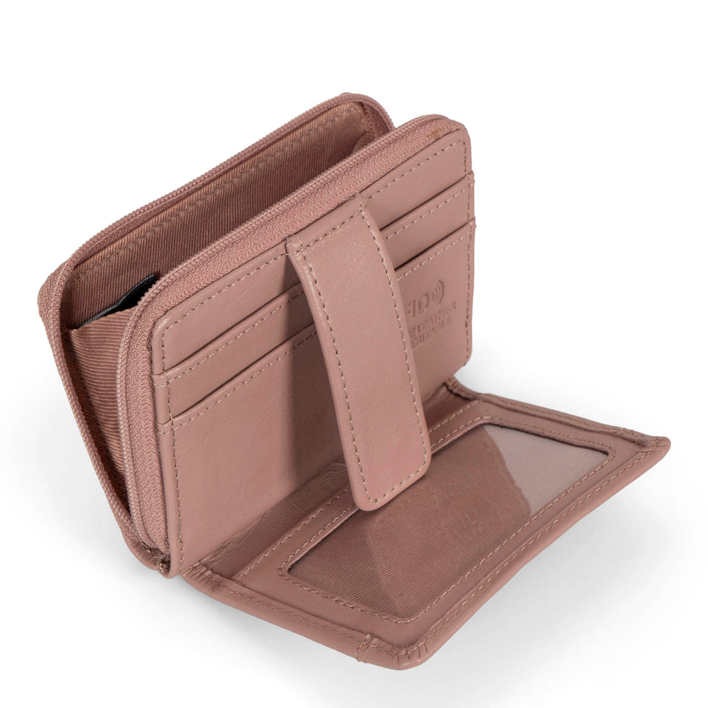 Interior view of a pink card holder called basics by tracker, showing its 2 front card slots, zipper, interior coin pocket, ID window, and closure strap.