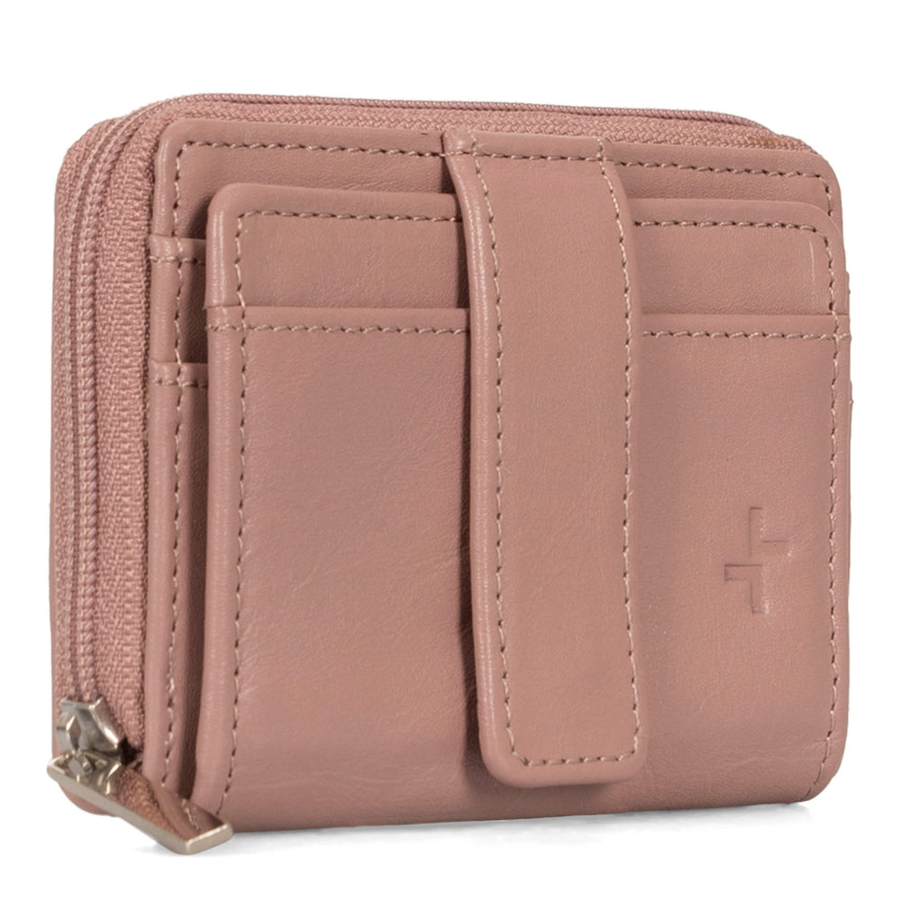 Angle view of a pink card holder called basics by tracker, showing its 2 front card slots, zipper, and closure strap.