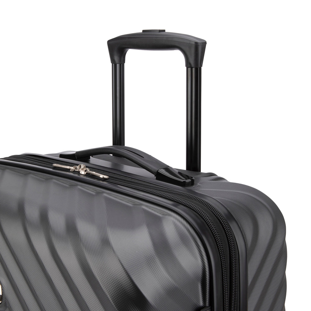 Close side view of a black hard side luggage called MOD designed by Swiss Gear sold at Bentley, showcasing its telescopic handle.