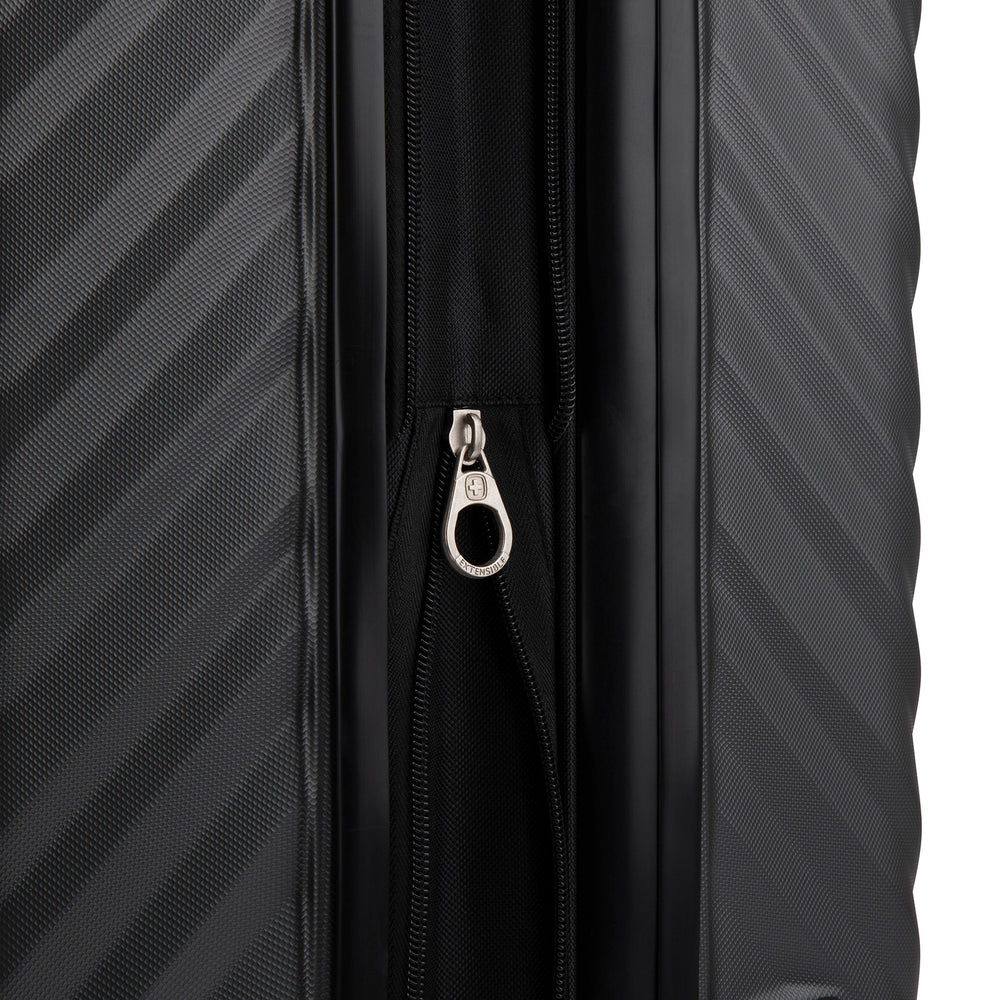 Close up view of a luggage called MOD designed by Swiss Gear sold at Bentley, showcasing its zipper pull tab with the logo.